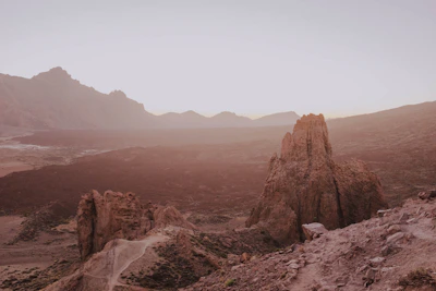 A distant mountain skyline under soft bronze morning light.