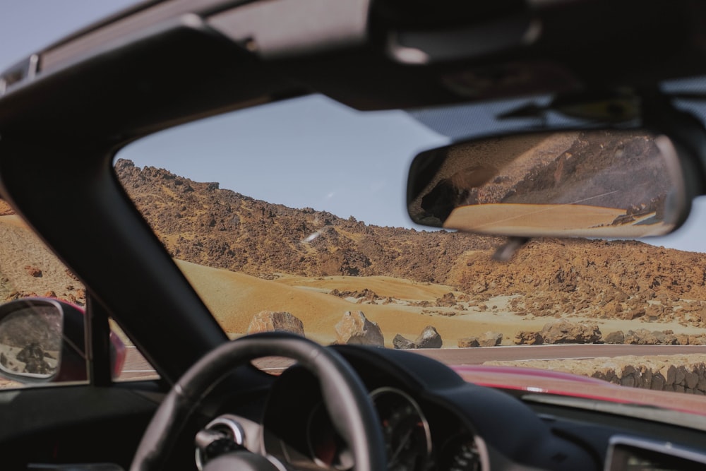 black car steering wheel during daytime