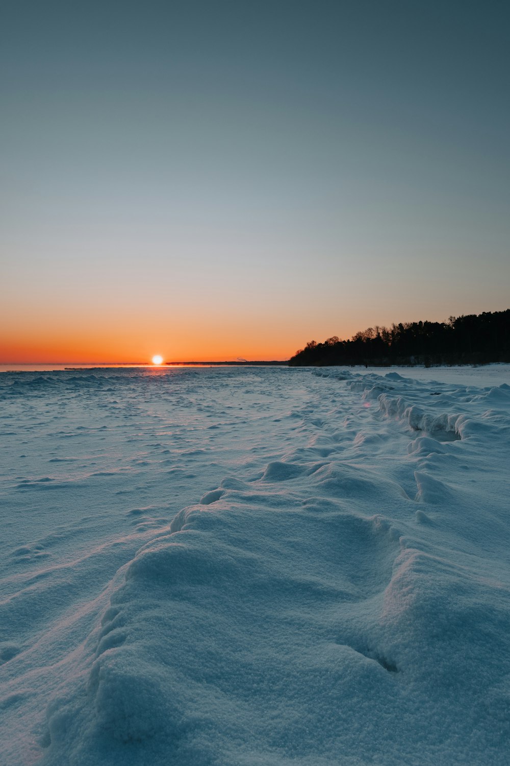 body of water during sunset