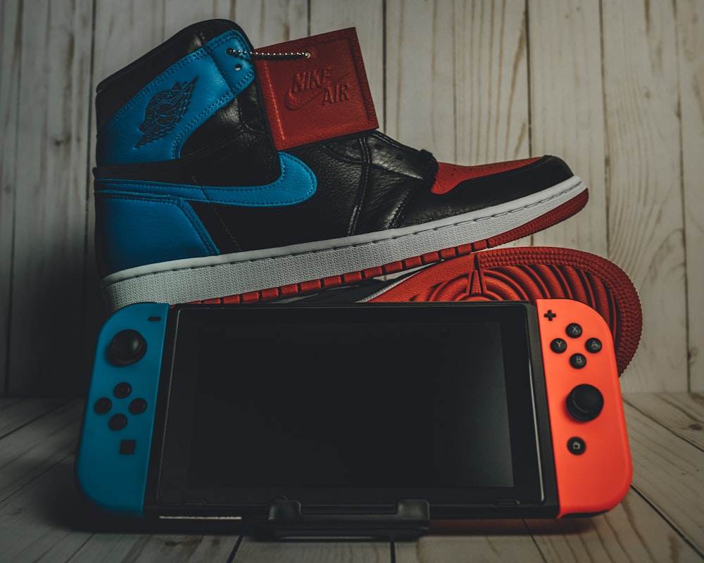 Black red and white air jordan 4 shoe photo – Free Nintendo switch Image on  Unsplash