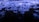 Waves of vibrant blue light ripple across a dark surface, creating a dynamic and fluid visual effect reminiscent of water or liquid textures. The intricate patterns and reflections evoke a sense of movement and energy.