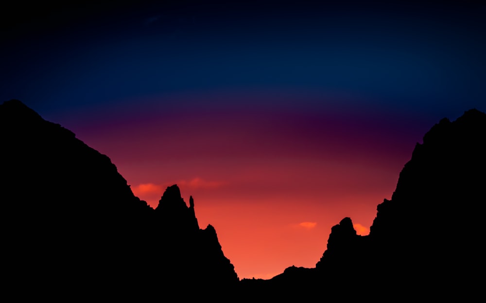 silhouette of mountain during sunset