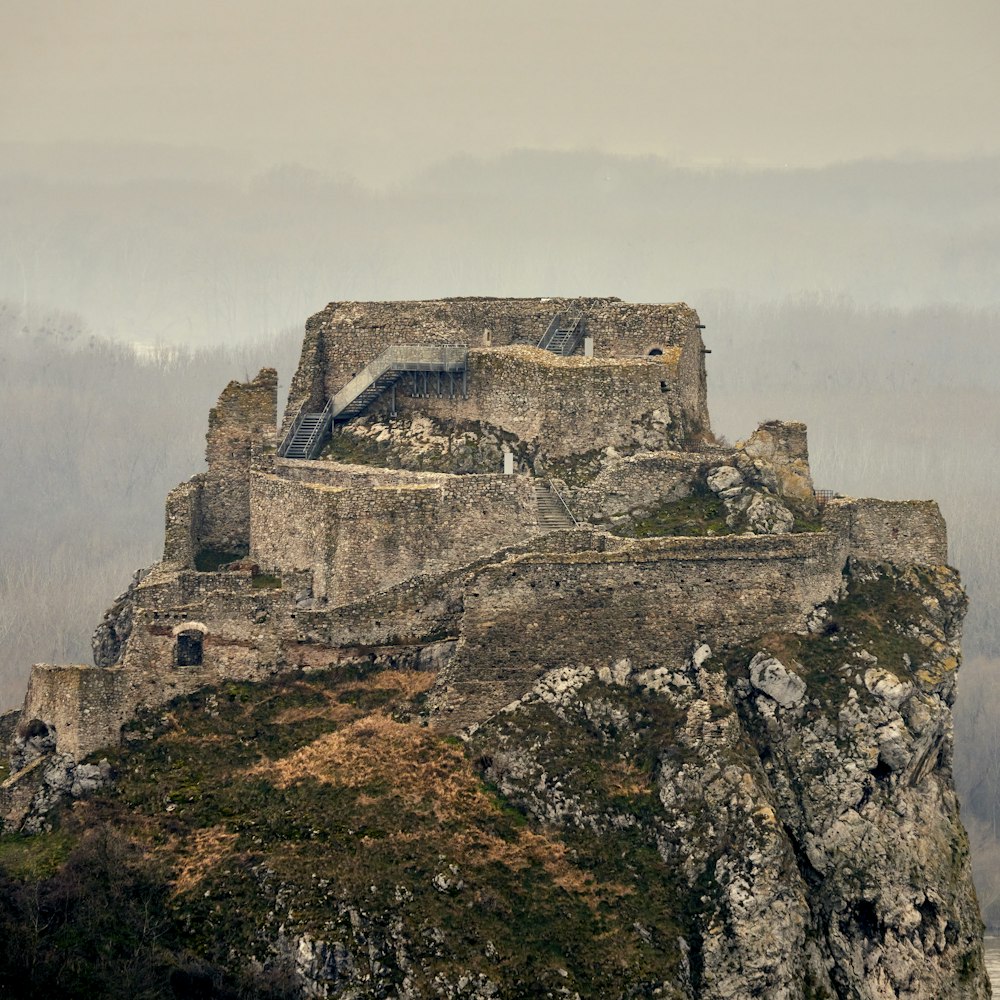 gray concrete castle on top of mountain