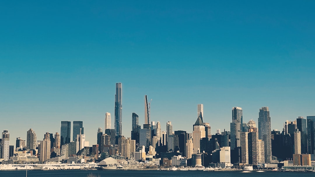 city skyline under blue sky during daytime