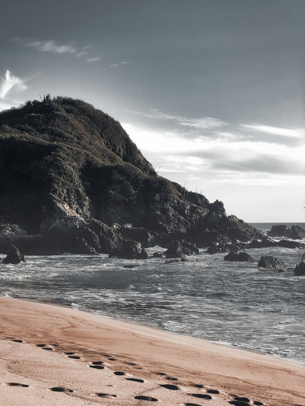 brown rock formation on sea shore during daytime