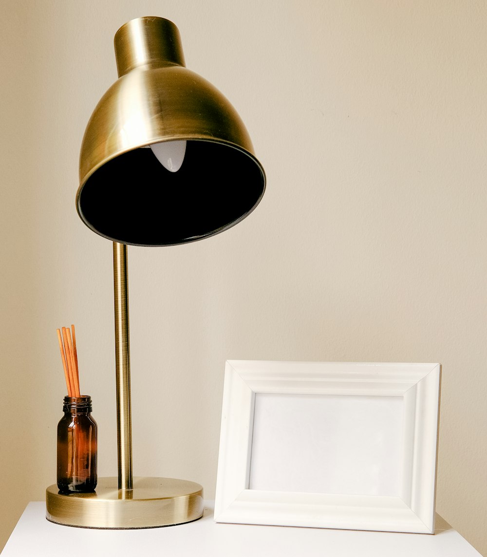 brass and white table lamp