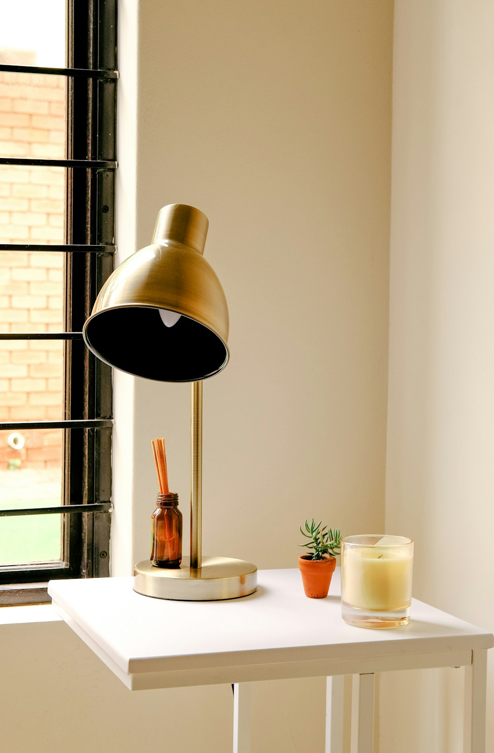 brass and white pendant lamp