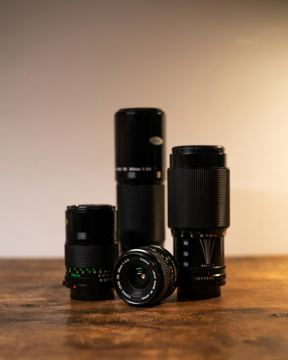 black camera lens on brown wooden table