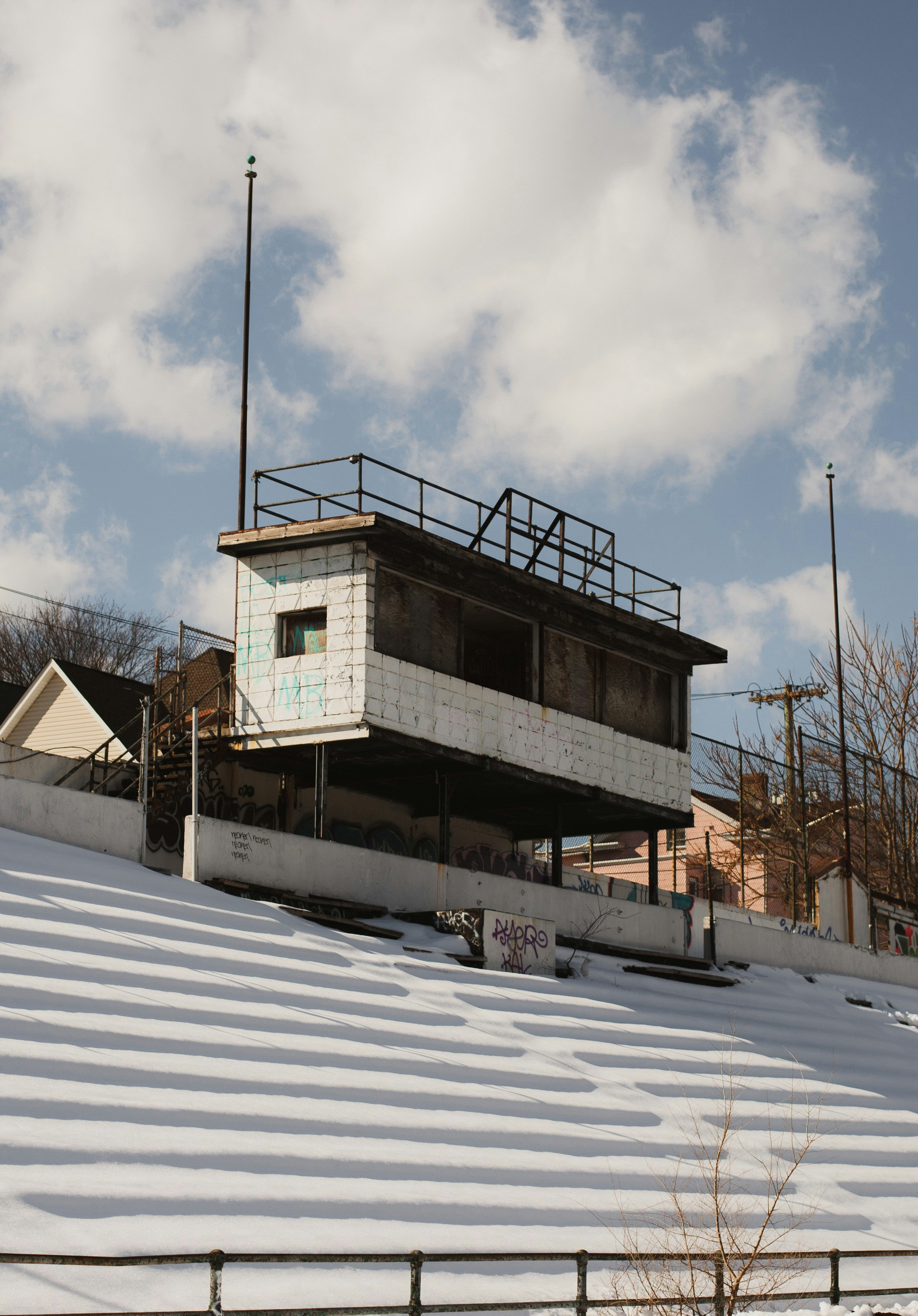 white and brown concrete building under white clouds during daytime