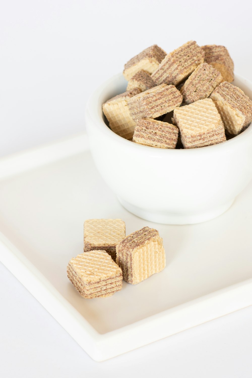brown biscuits on white ceramic bowl