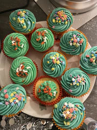 green pink and blue floral cupcakes
