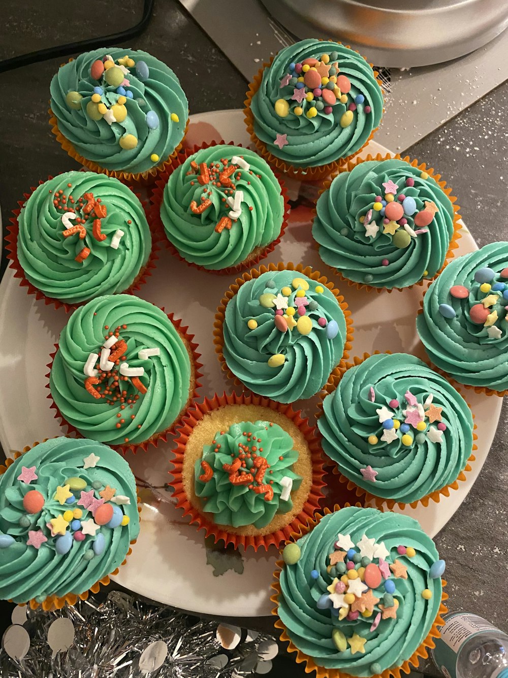 green pink and blue floral cupcakes