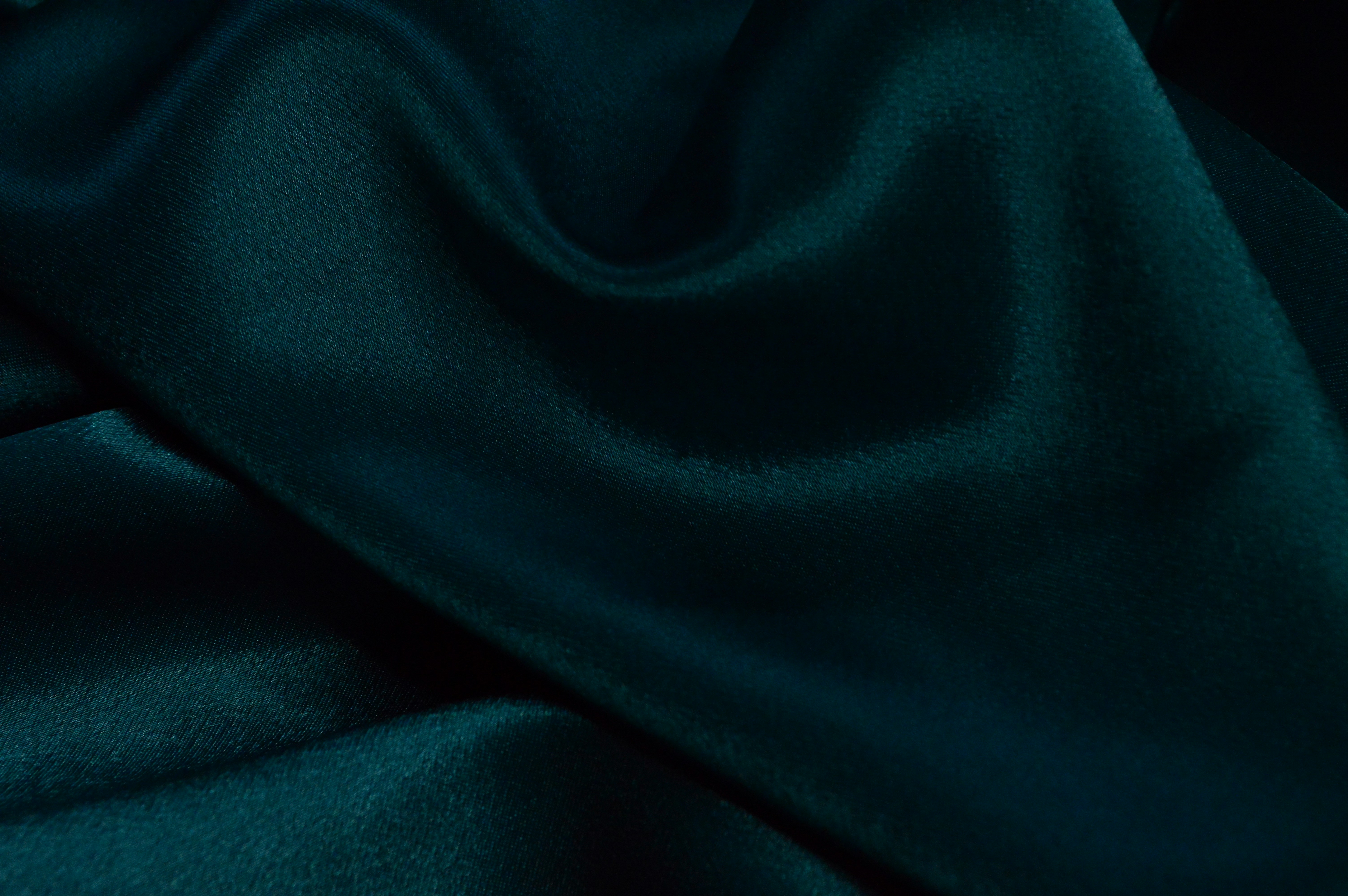 red textile on white textile