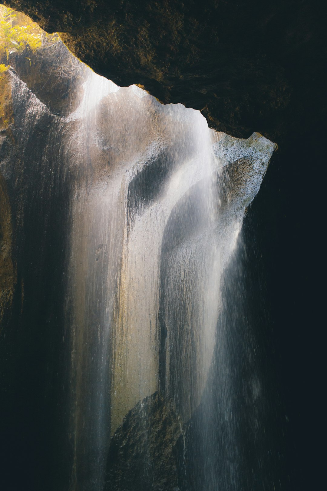 water falls in black cave