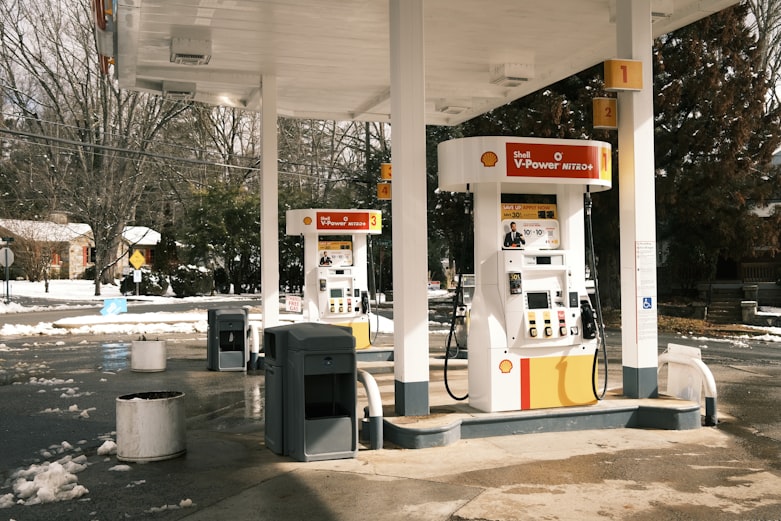 white gas pump near white gas pump