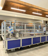 A modern manufacturing plant bustling with activity and machinery.