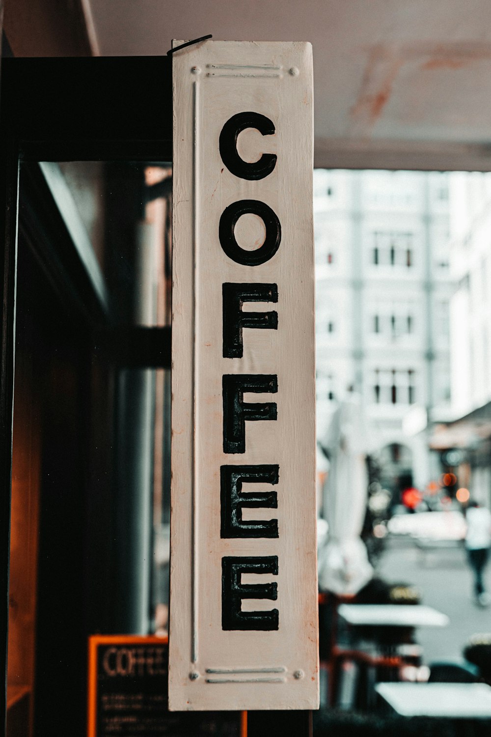 brown and white wooden signage