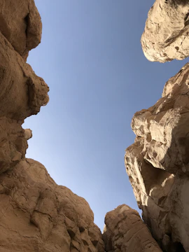 A breathtaking view of the Copper Canyon's rugged cliffs under a clear blue sky.