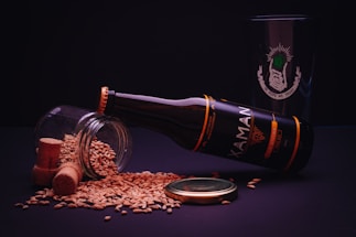 brown glass bottle beside brown round food