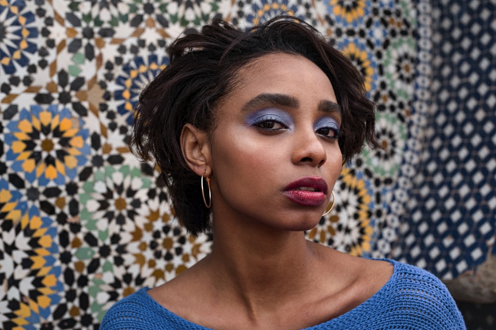 woman in blue crew neck shirt with red lipstick