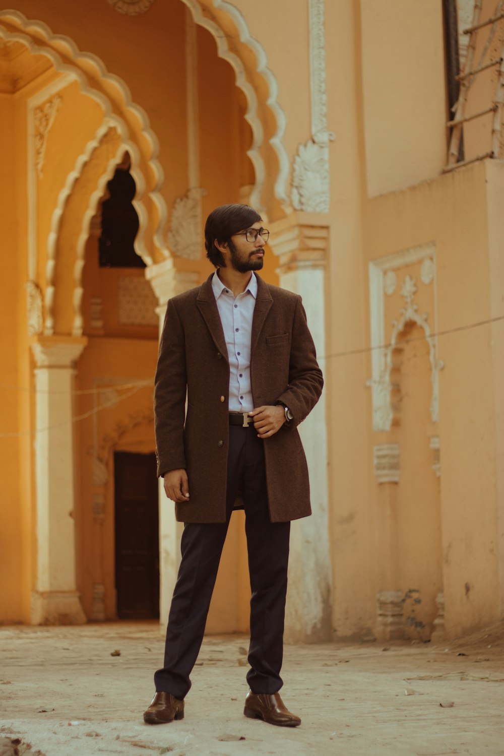 a man standing in front of a building