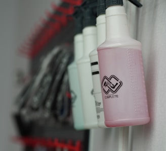 white and pink plastic bottle