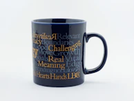 A ceramic mug showcasing a heartfelt photo and text print, perfect for gifting.