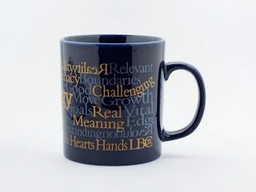 A vibrant custom mug featuring a colorful photo and personalized text.