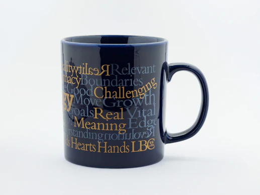 A sleek, custom-designed mug featuring a personalized photo and text.
