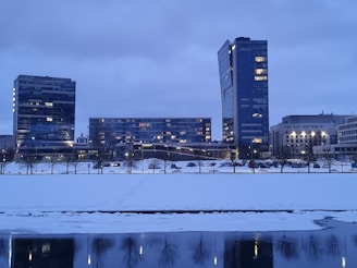 A snowy Canadian cityscape with modern office buildings.