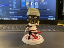 Close-up of a 3D model of a playful toy character on a computer screen.