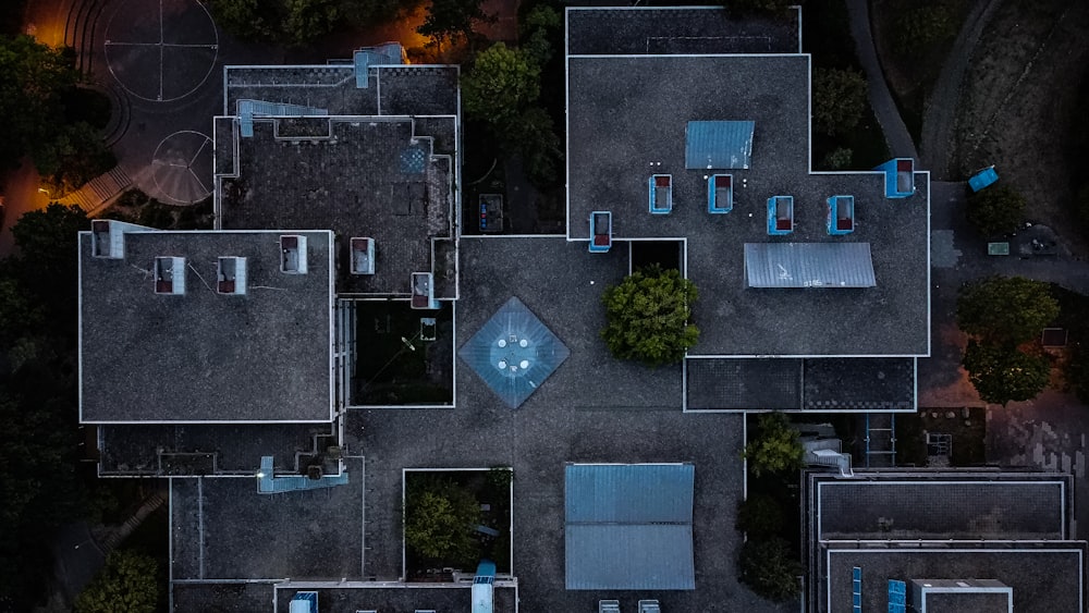 aerial view of green trees and gray concrete building