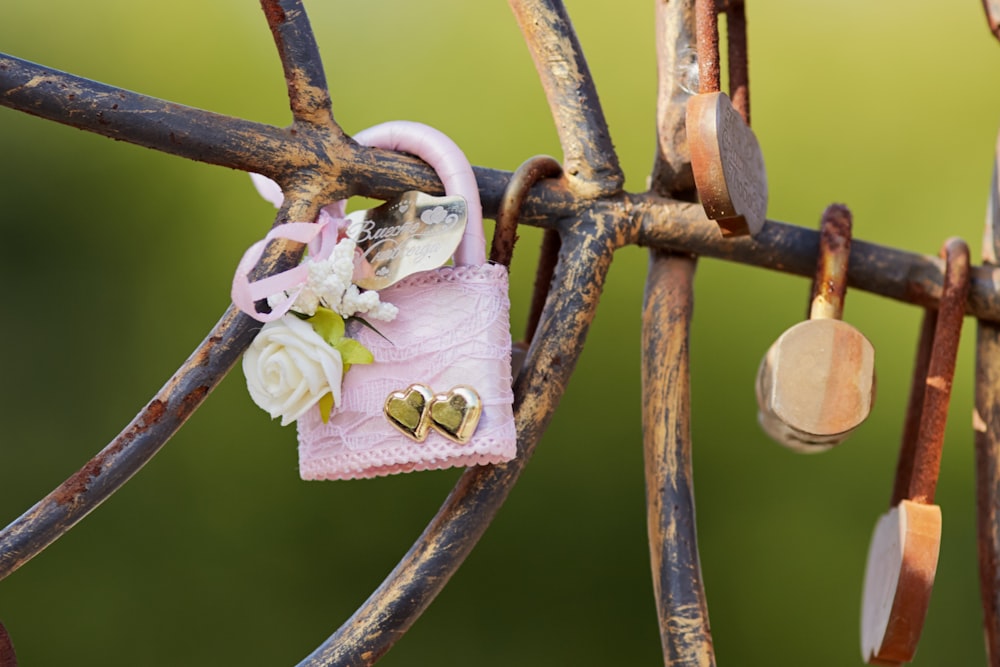 brown and gray padlock on brown metal fence