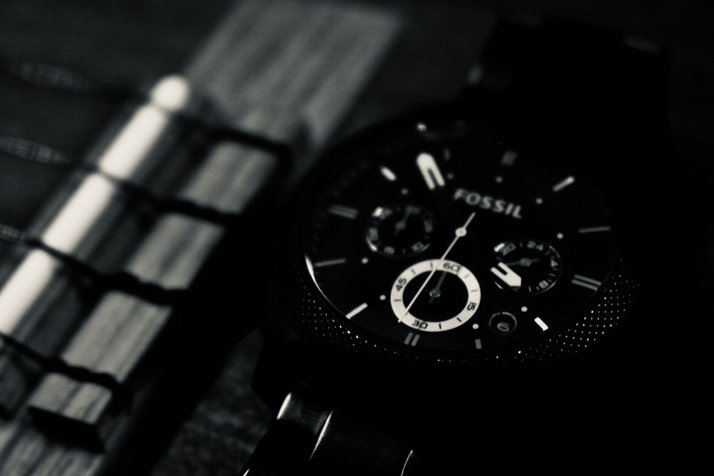black and silver round chronograph watch