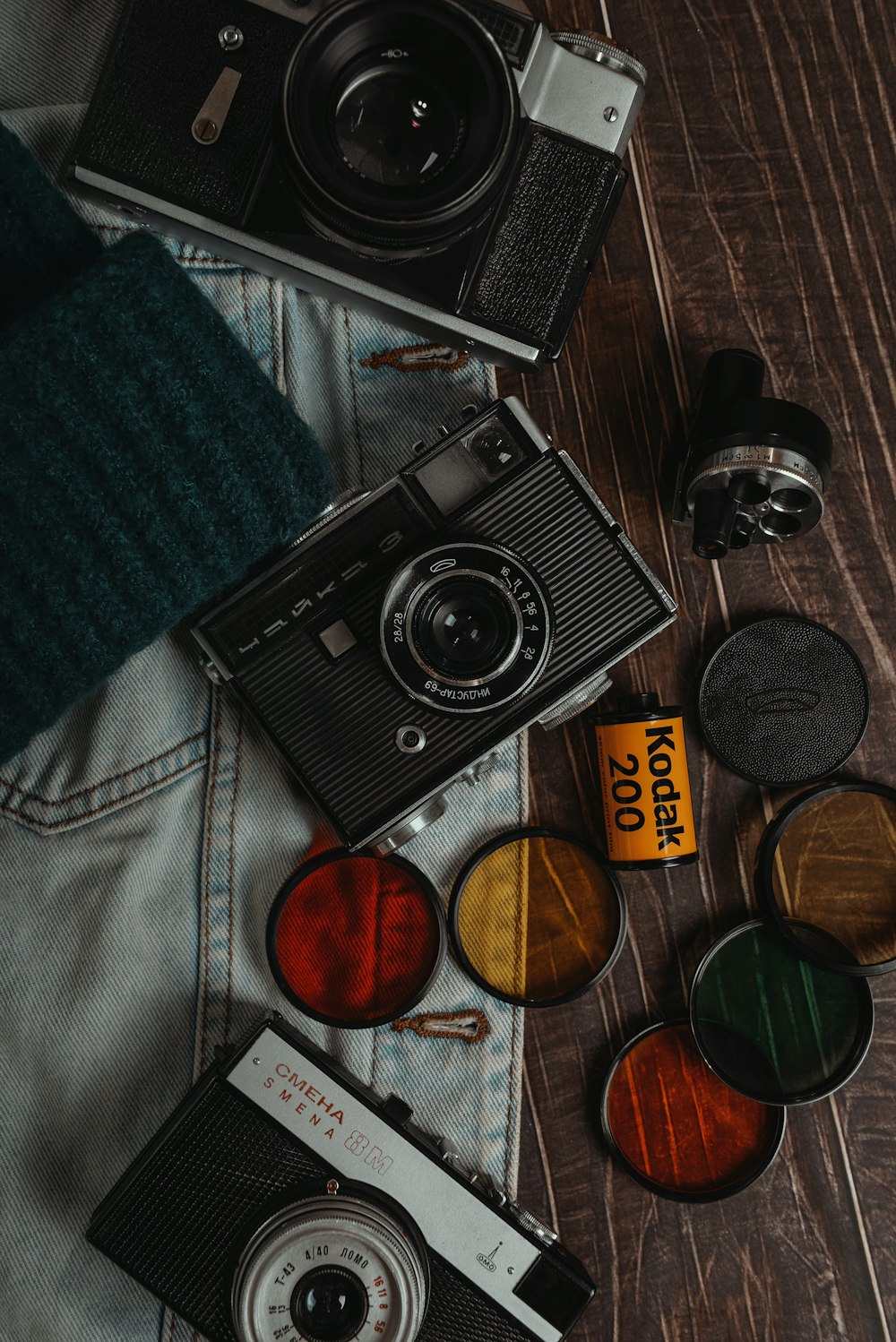 black and silver camera on blue textile