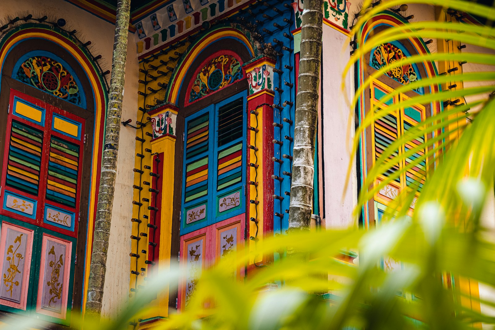Brightly painted shutters, doors and arches of the House of Tan Teng Niah, a 1900 villa in Little India