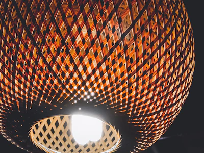 Close-up of a handcrafted wooden lampshade with natural grain patterns