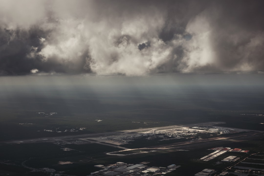 white clouds over city during daytime