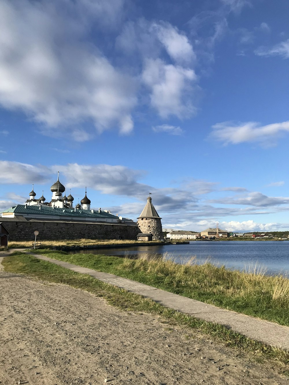 people walking on dock under blue sky during daytime