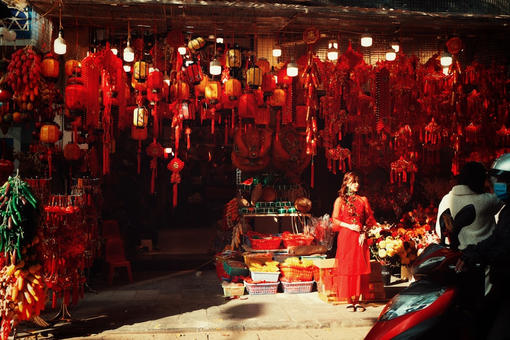 people in red traditional dress dancing on street during daytime