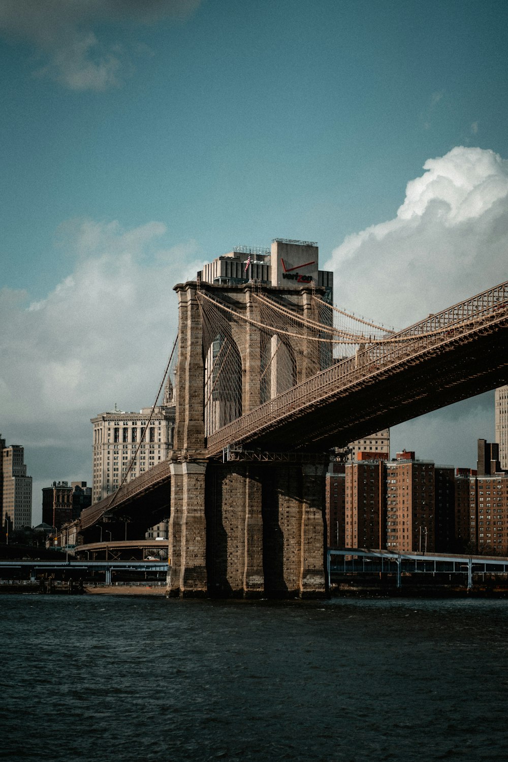 brown bridge under blue sky during daytime