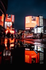 people walking on street during night time