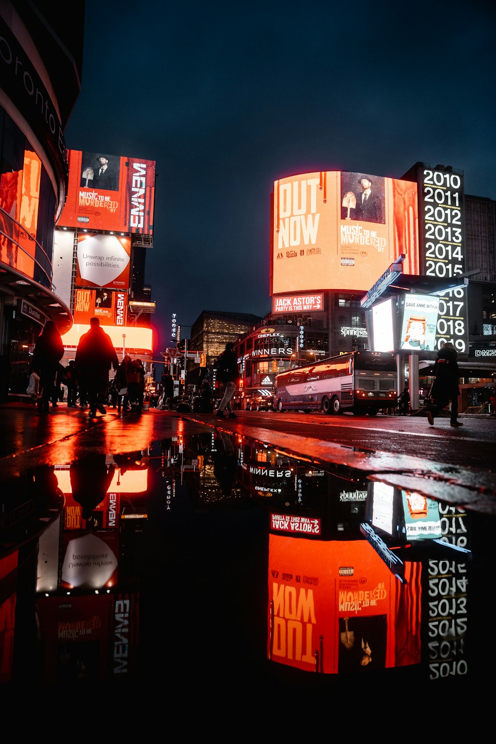 people walking on street during night time