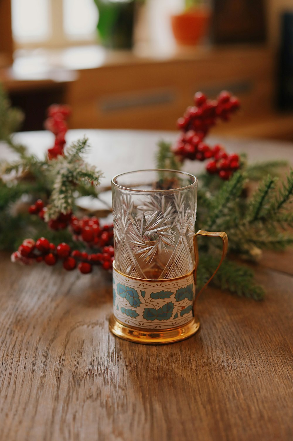 clear drinking glass with brown liquid inside