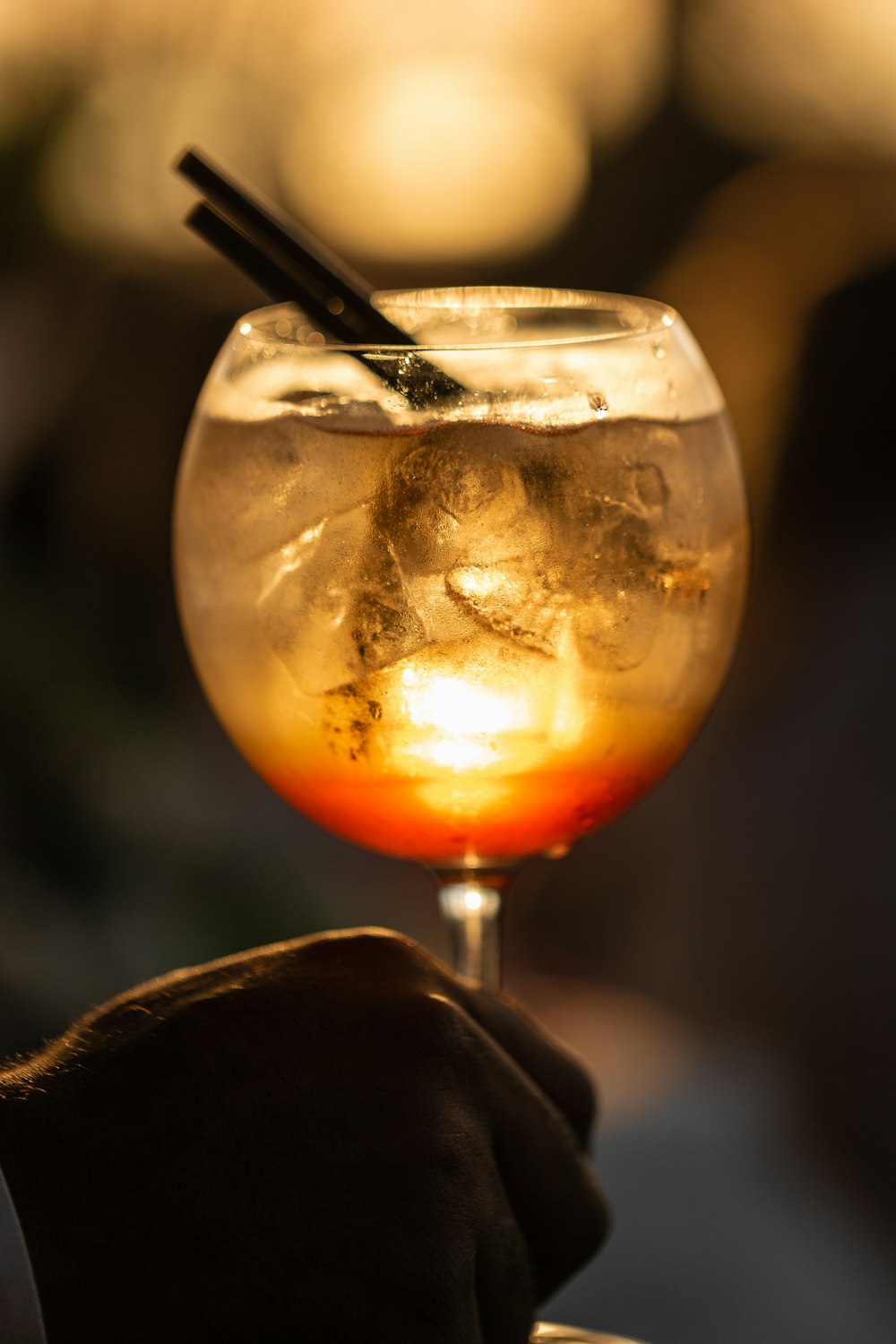 clear wine glass with brown liquid