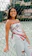 A happy young woman wearing stylish sneakers from Linasto, smiling outdoors.