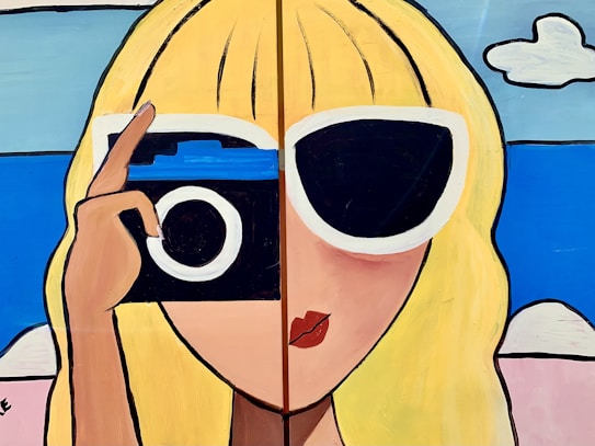 A stylized painting featuring a person with long blonde hair. One eye is covered by large white-framed sunglasses and the other by a classic camera. The background includes a blue sky and clouds, suggesting a sunny day. The artwork uses bold black outlines and bright colors, contributing to a pop-art style.