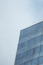 Close-up of a sleek modern window with double glazing reflecting a bright sky.