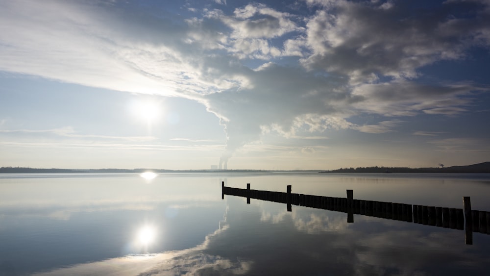 blue sky and white clouds over calm sea