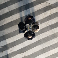 A group of friends checking their ranks together on a tablet.